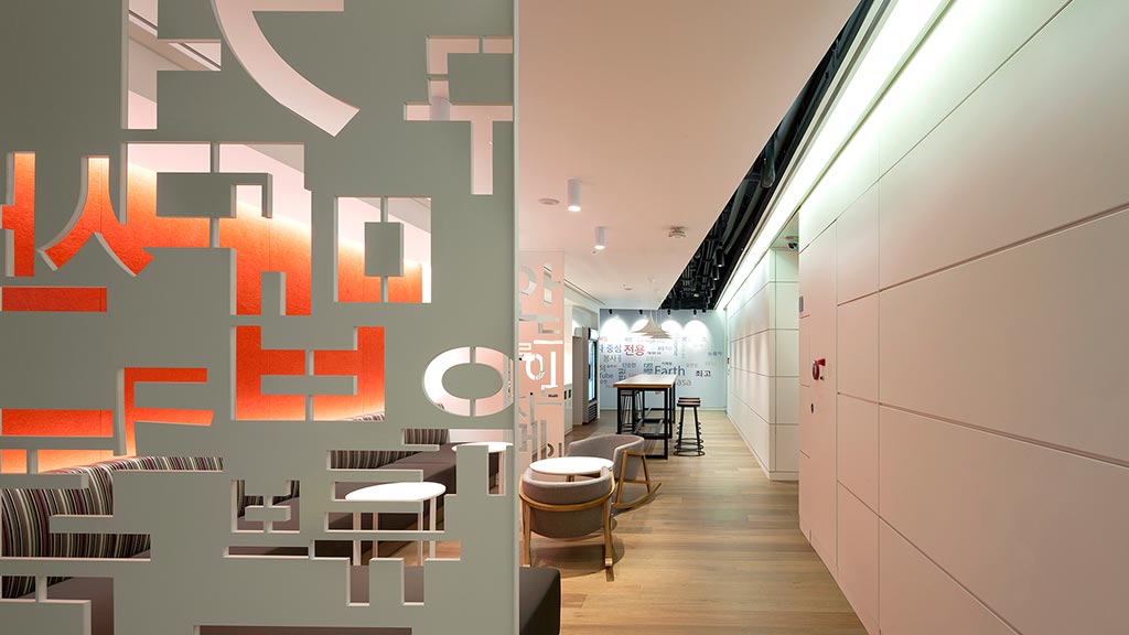 A long hallway with chairs and tables.