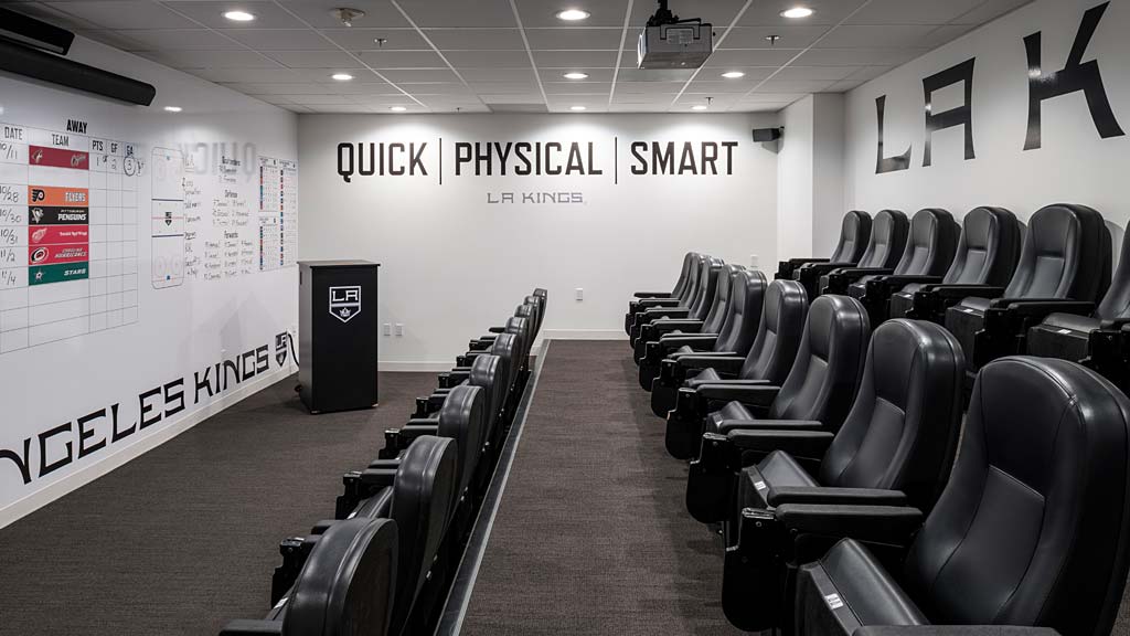 A room with chairs and a sign.