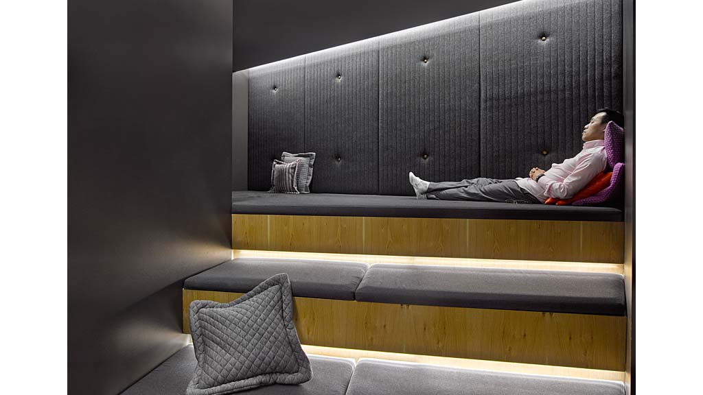 A person lying on a bench.