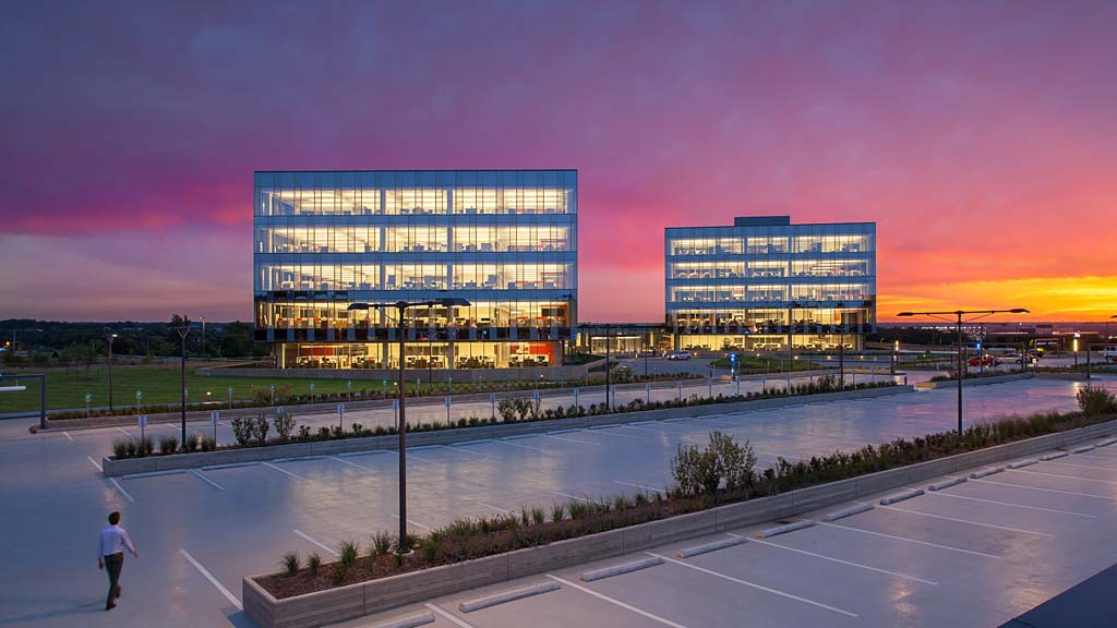 A building with a body of water in front of it.
