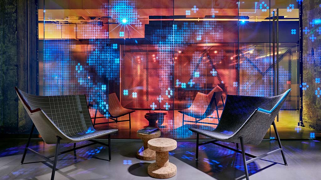 A room with a glass wall and a piano.