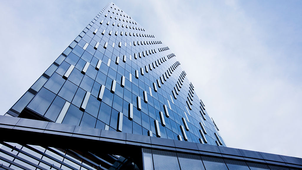 A tall building with glass windows.
