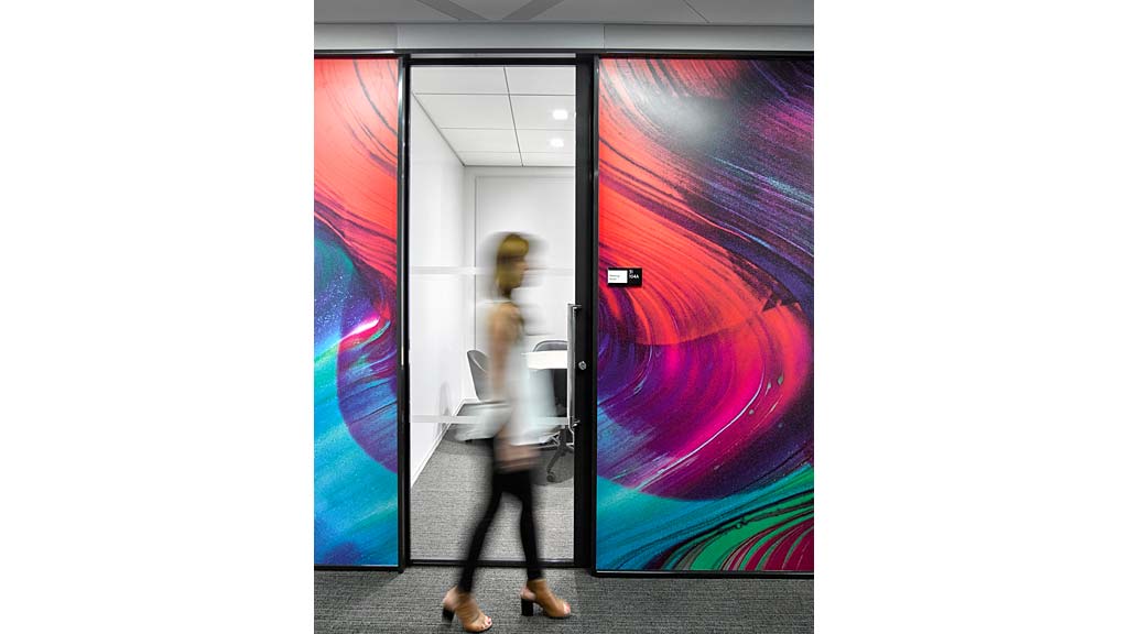 A person walking through a doorway.