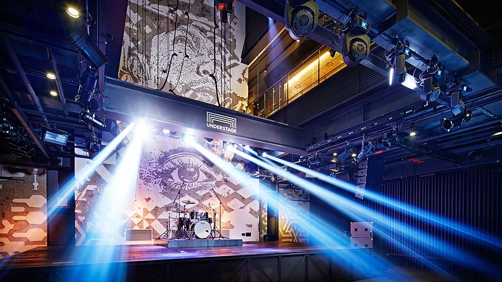 A stage with a large crowd.