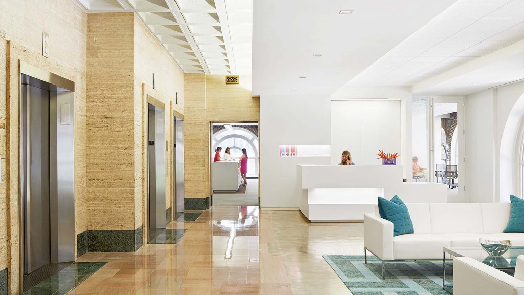 A room with a couch and a table.