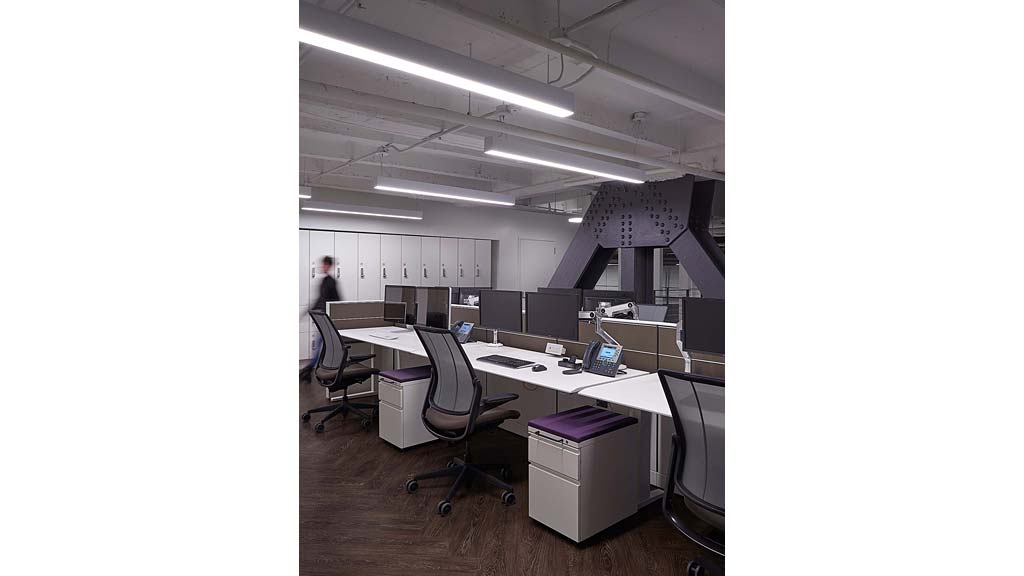 An office with a large desk and computer.