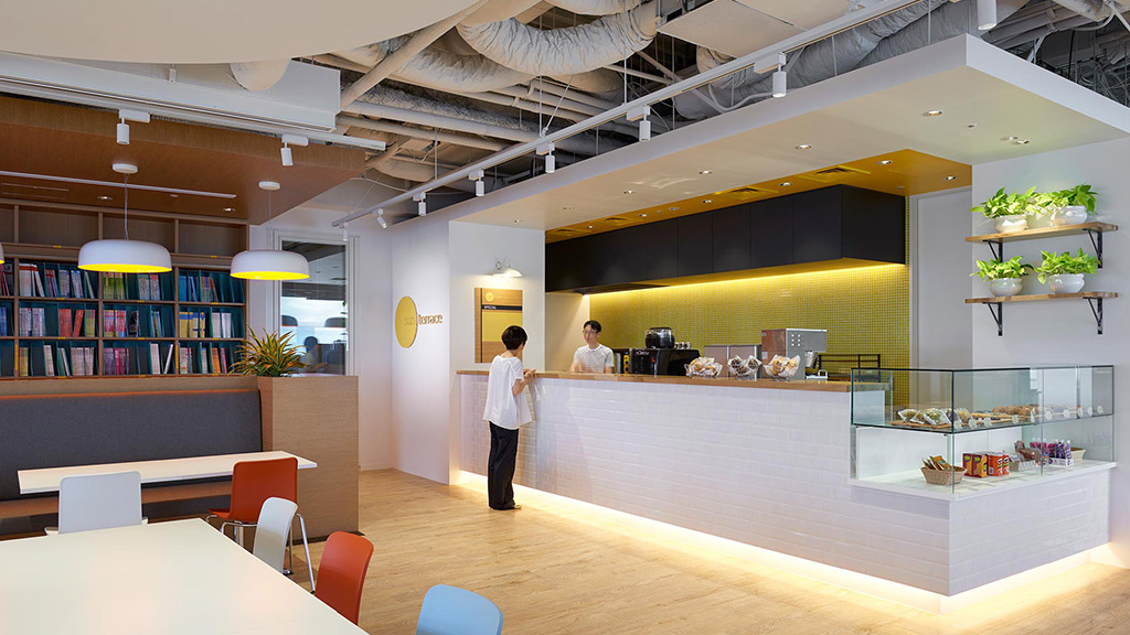 A few people in a library.