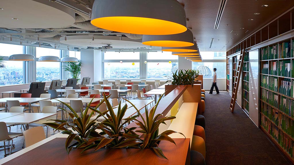 A room with tables and chairs.