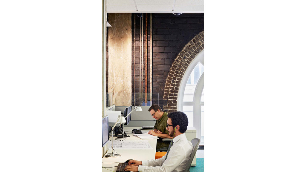 Men working at a computer.