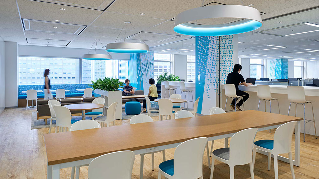 A room with tables and chairs.