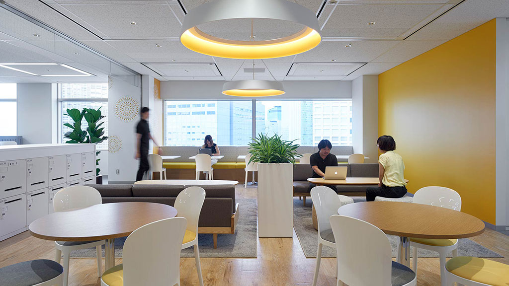 A room with tables and chairs.