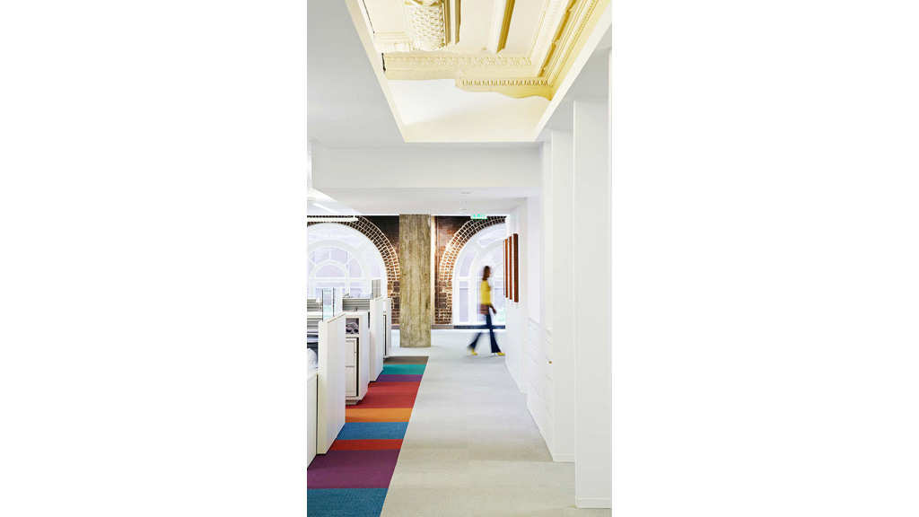 A person walking through a hallway.