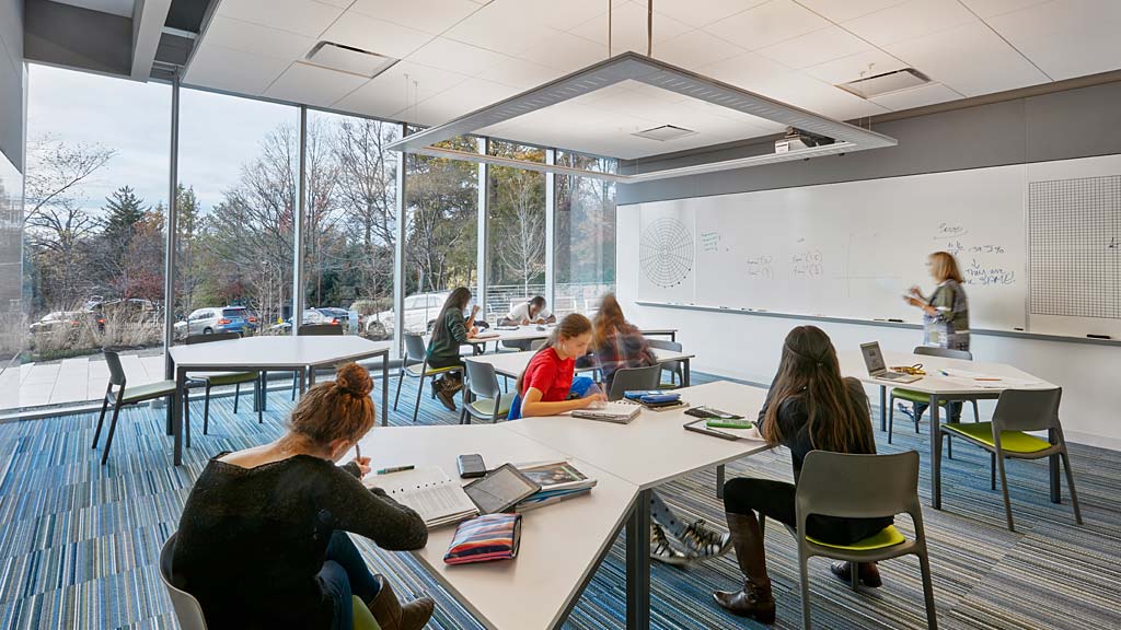 A group of people sitting at tables.
