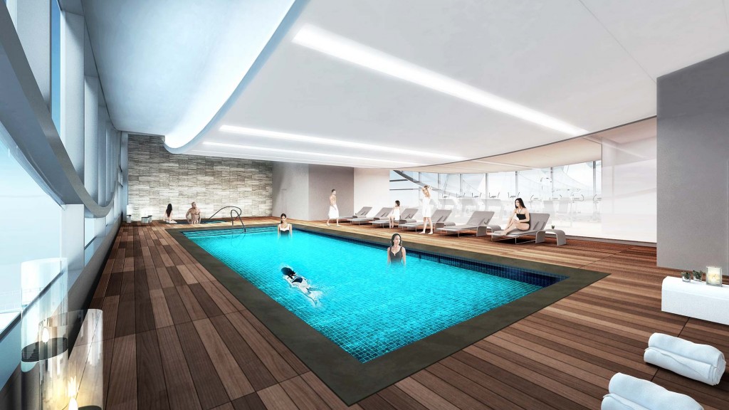 A pool with people sitting around it.