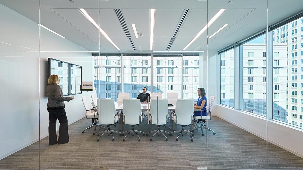 A few people in an office.