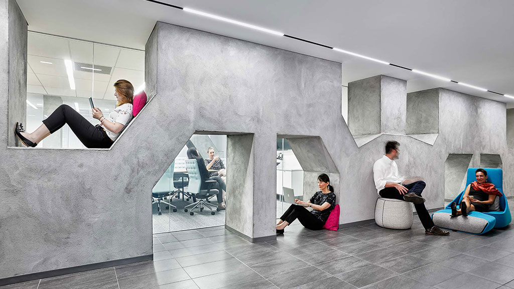 A group of people sitting on stairs.