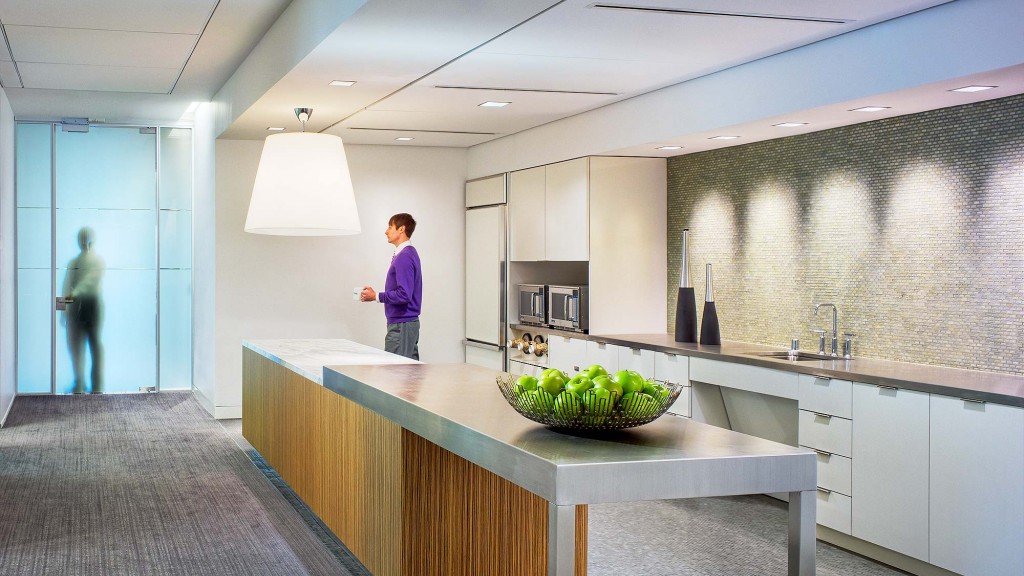 A couple of women in a kitchen.