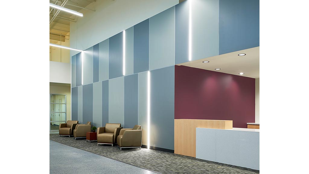 A room with a red wall and blue walls.