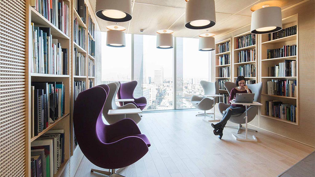 A person sitting in a library.