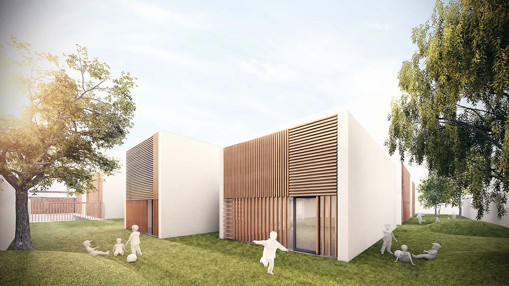 A group of white rabbits in a grassy area next to a building.