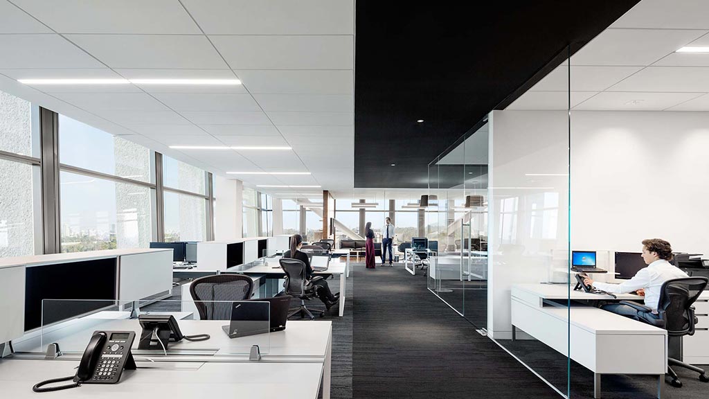 A person sitting at a desk in an office.