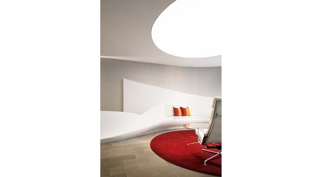 A room with a bed and a chair.