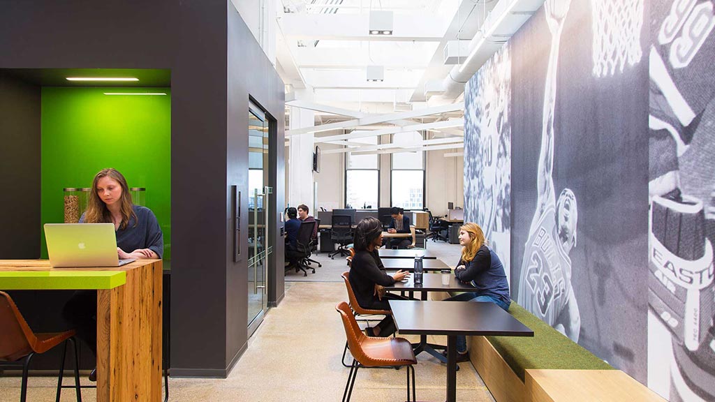 A group of people sitting at tables.