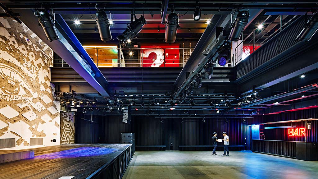 A couple of people in a bowling alley.