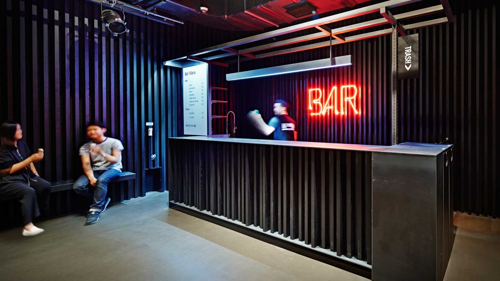 A group of people sitting on a stage.