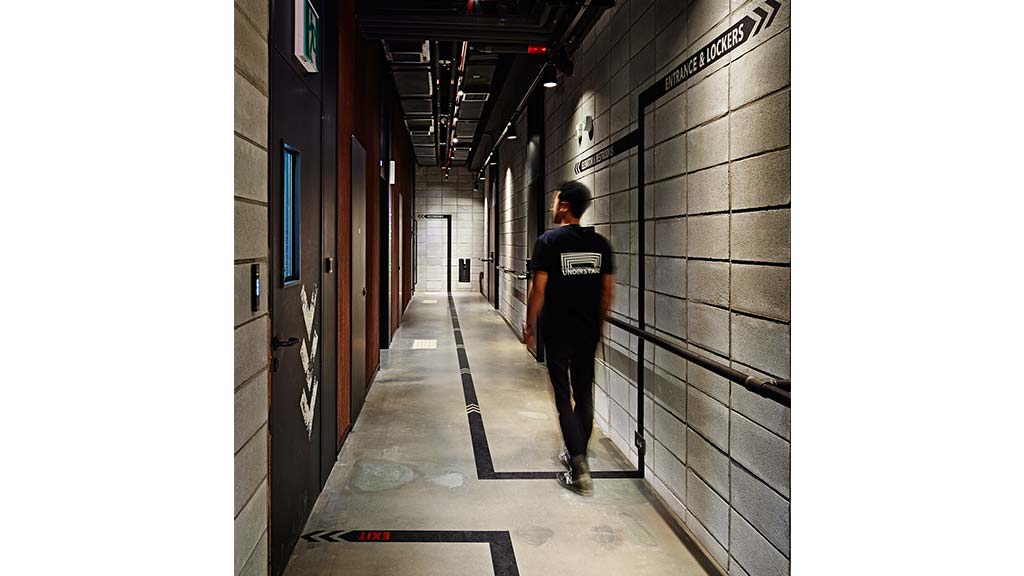 A person walking down a hallway.