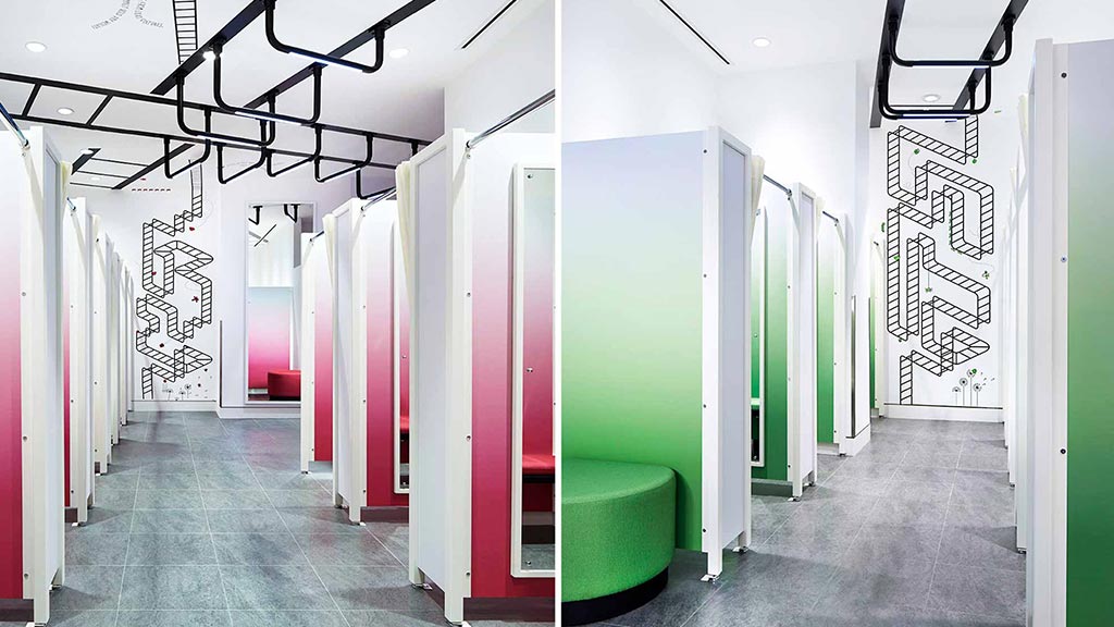 A room with green chairs and white walls.