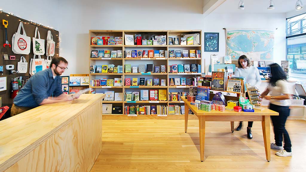 A group of people in a library.