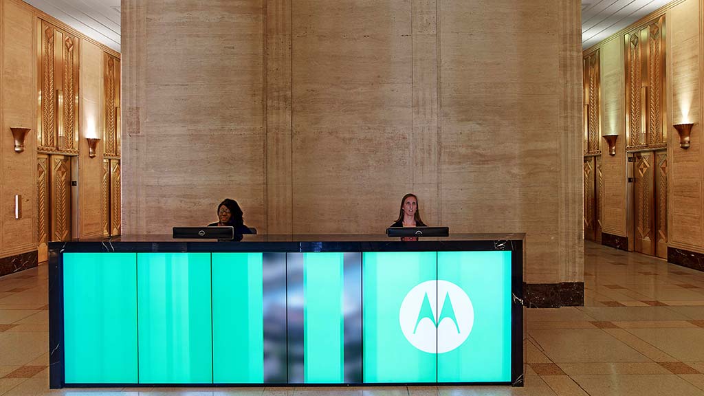 A person sitting at a podium.