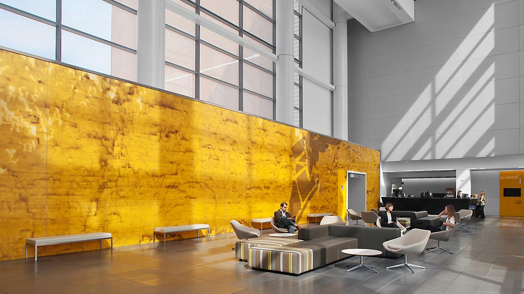 A room with a large mural on the wall.