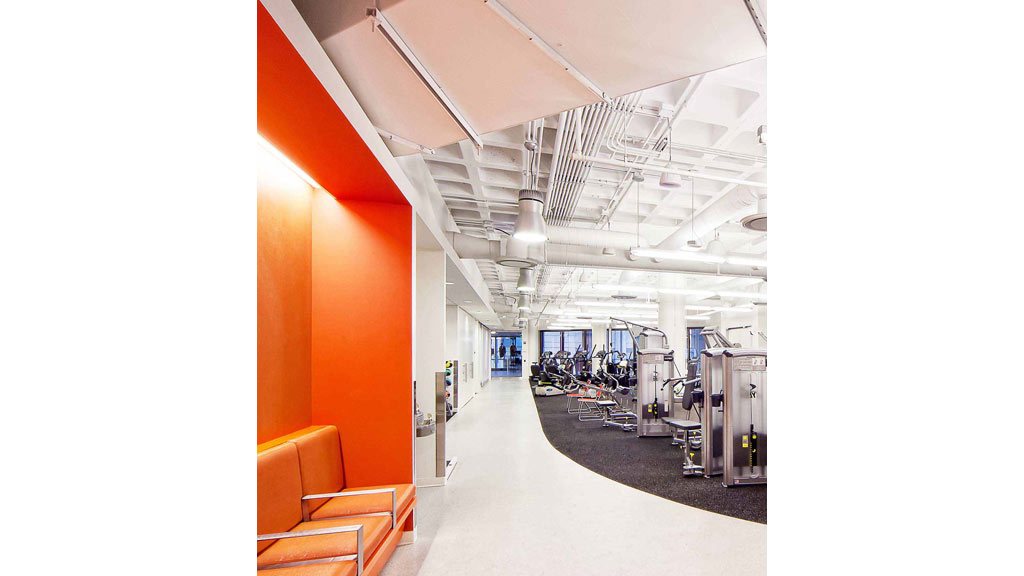 A long hallway with orange walls.