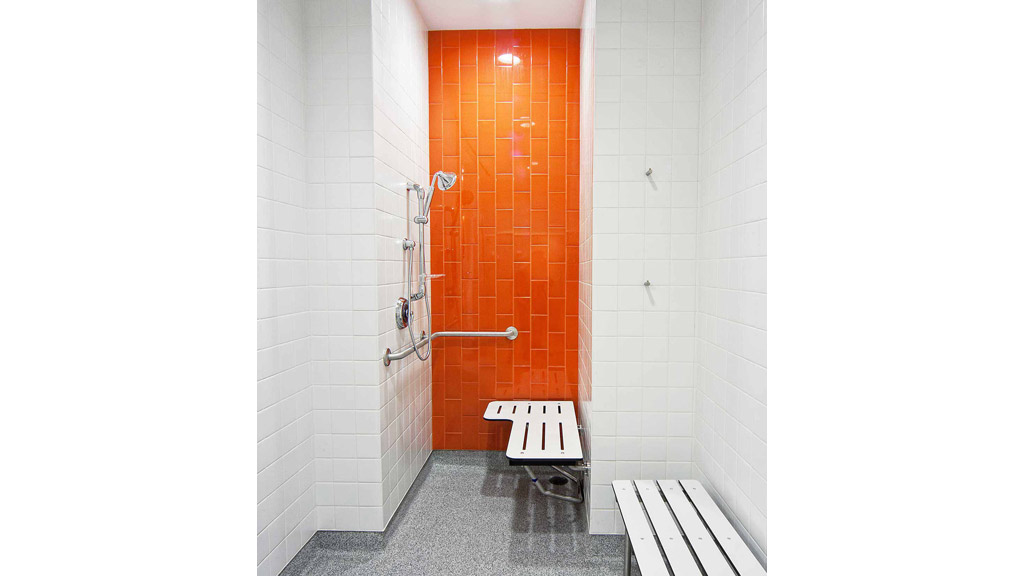 A bathroom with a bench.