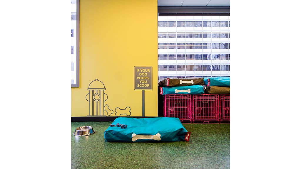 A room with a bed and a sign on the wall.