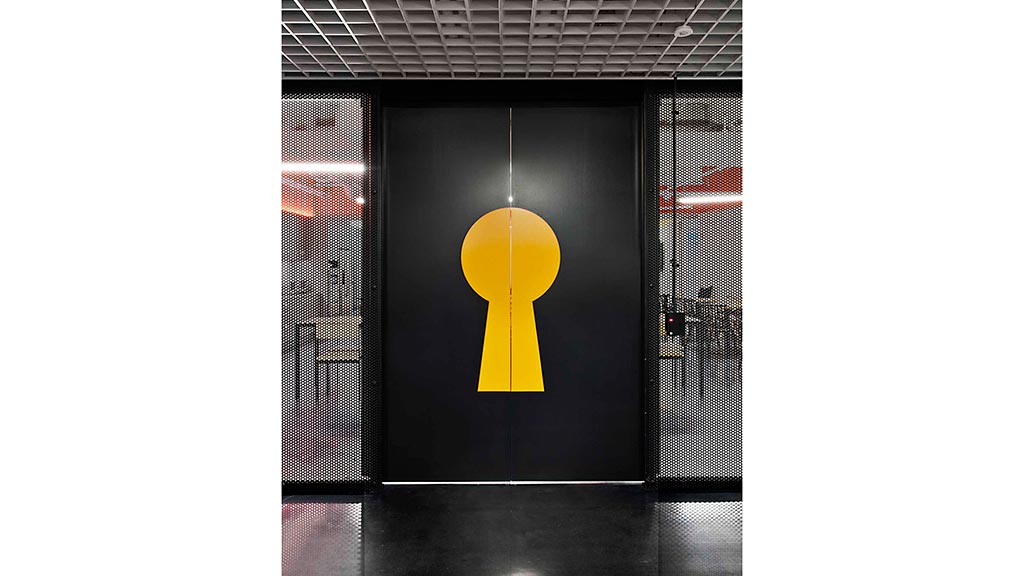 A yellow circle in a black room.