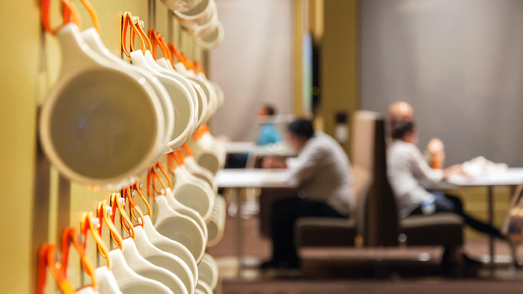 A few people sitting at a table.