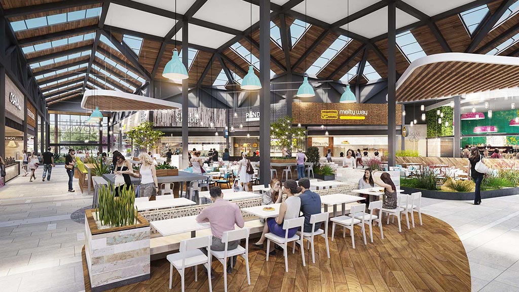 A group of people sitting at tables.