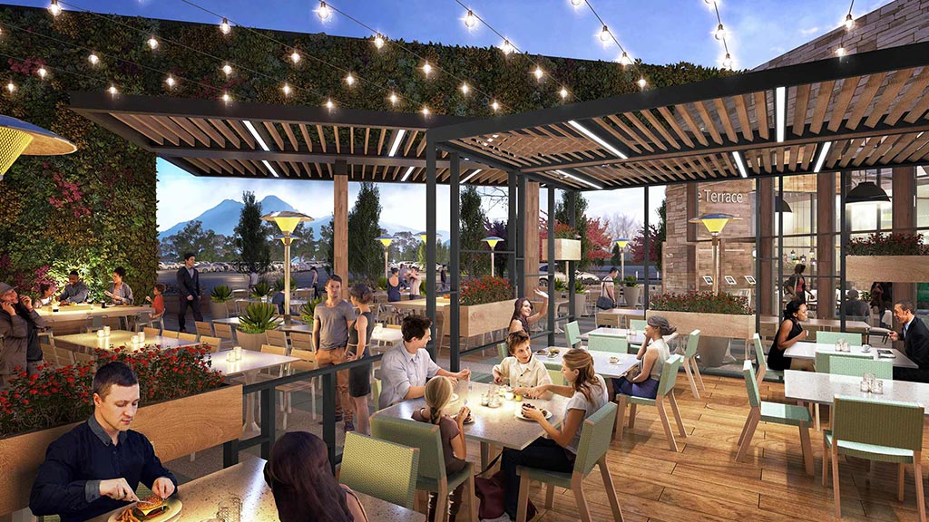 People sitting at tables outside.