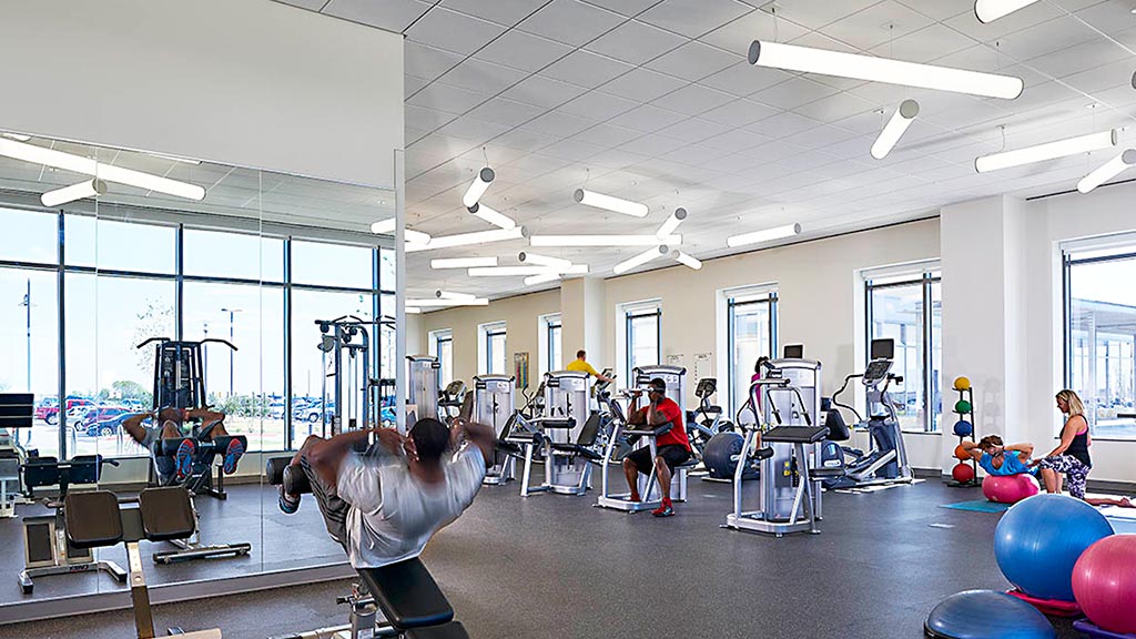 A group of people exercising in a gym.