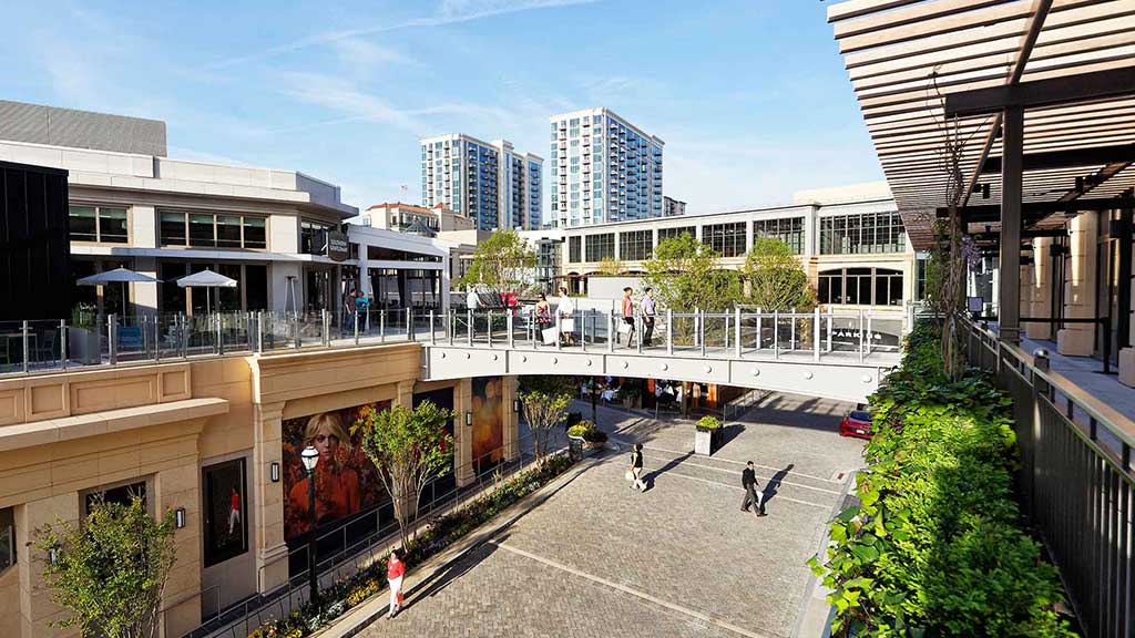 A courtyard with buildings and trees.