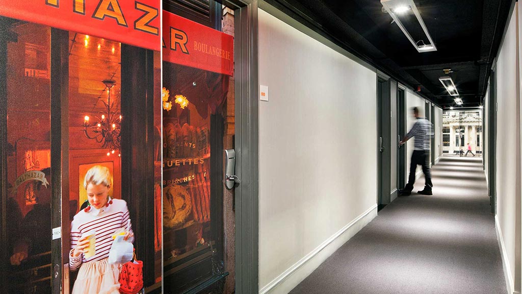 A person walking in a hallway.