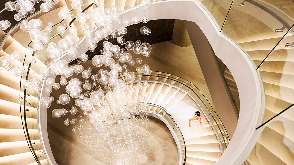 A person standing in a spiral staircase.