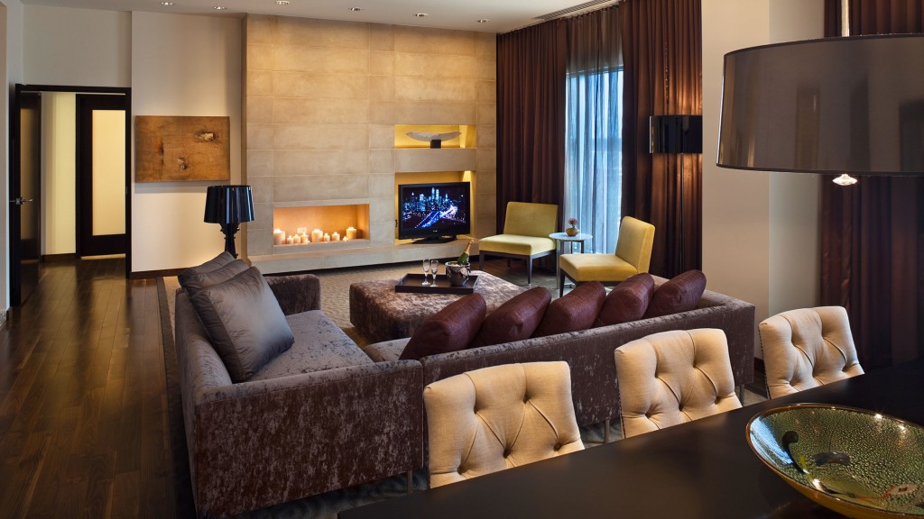 A living room with a large television.