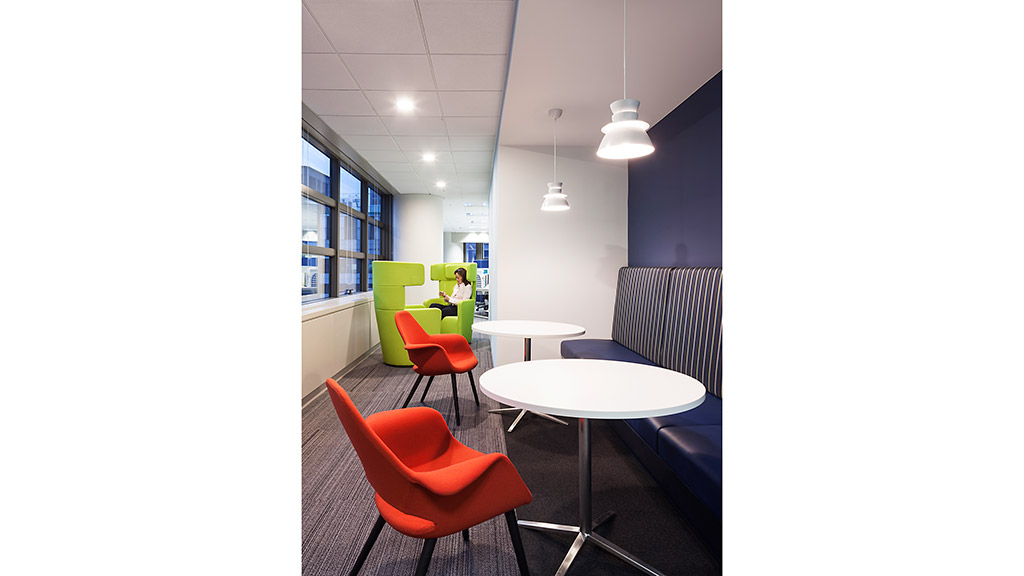 A room with chairs and a table.