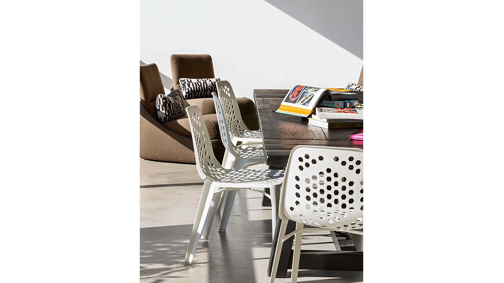 A table with chairs and a book on it.