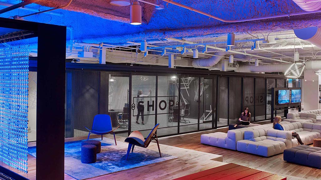 A room with a stage and chairs.