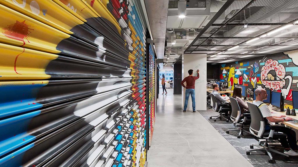People sitting at tables in a room.